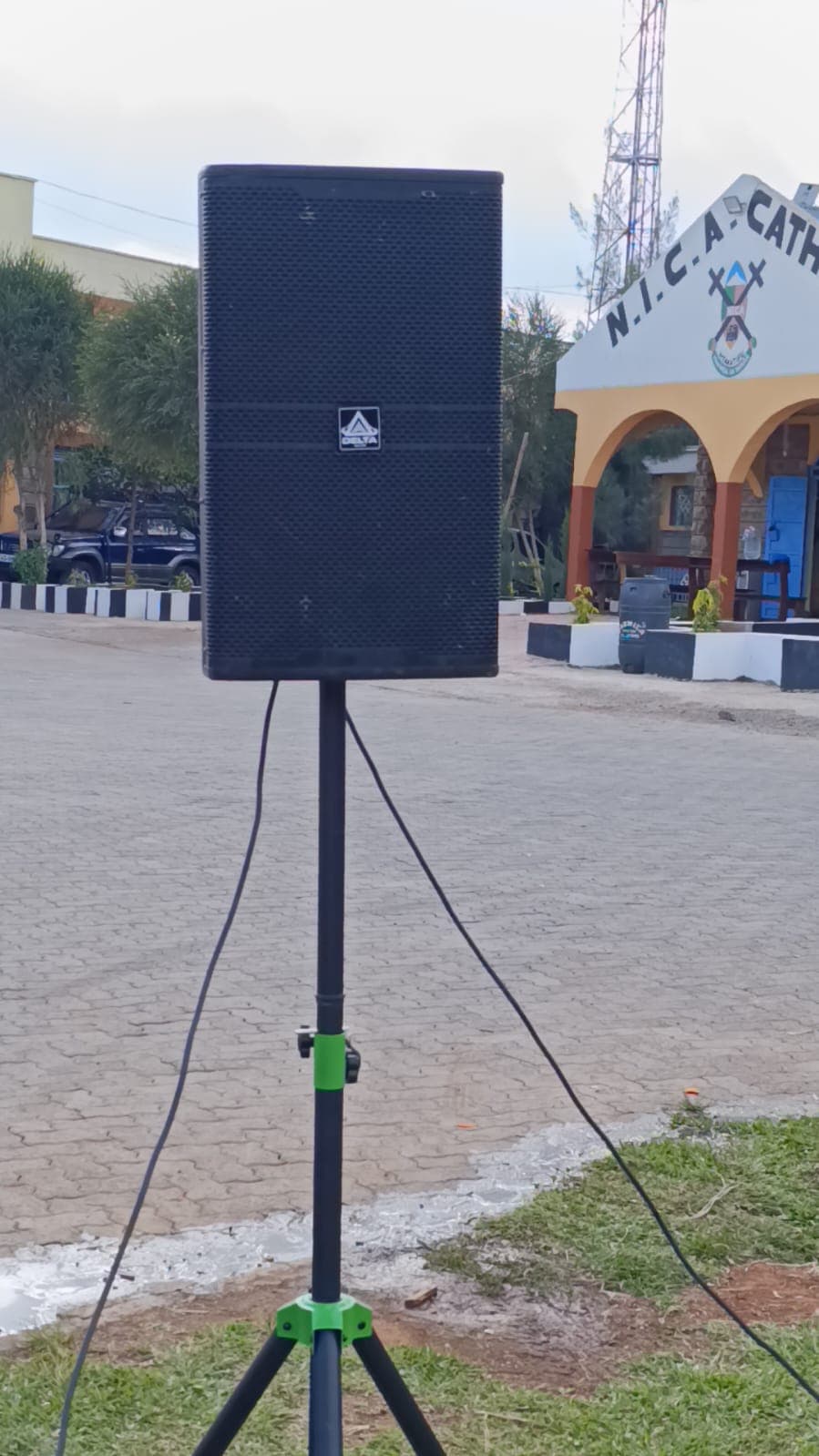 Speaker and subwoofer setup in a courtyard